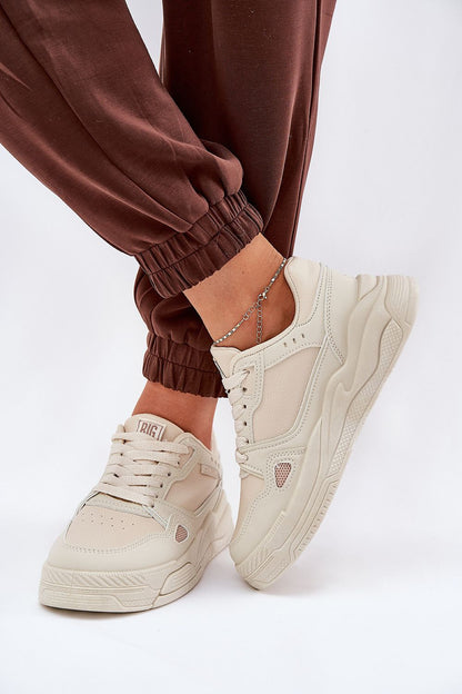 beige sport shoes front view