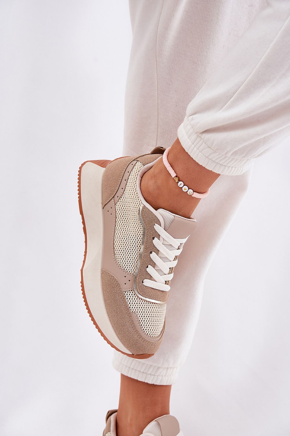 beige sport shoes detail view