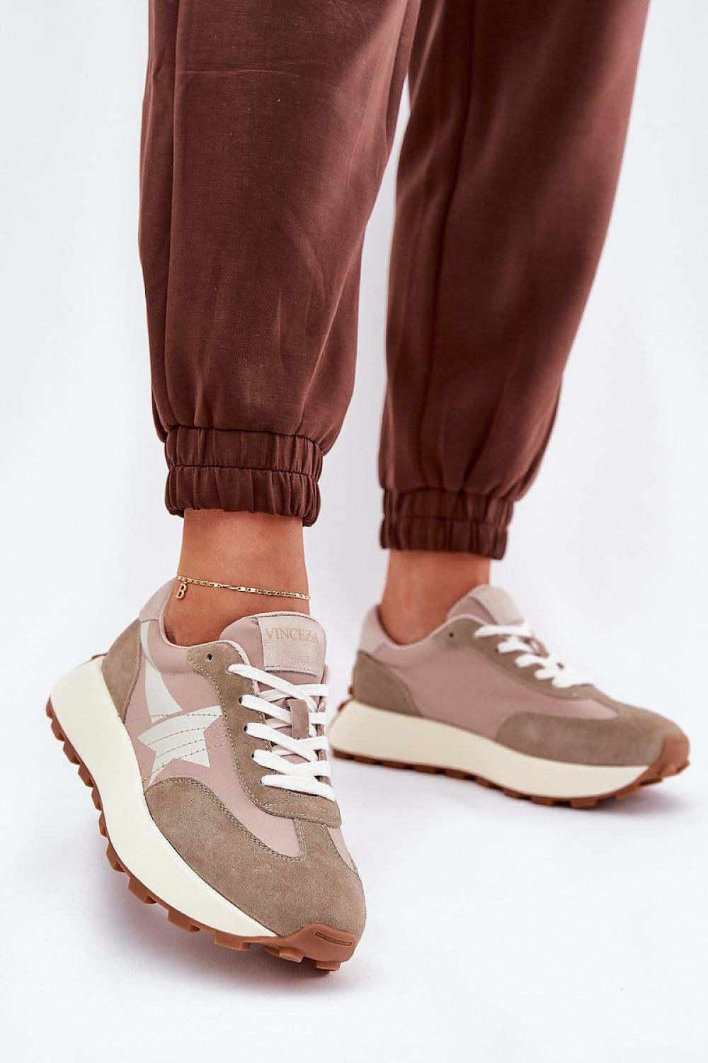 beige sport shoes front view