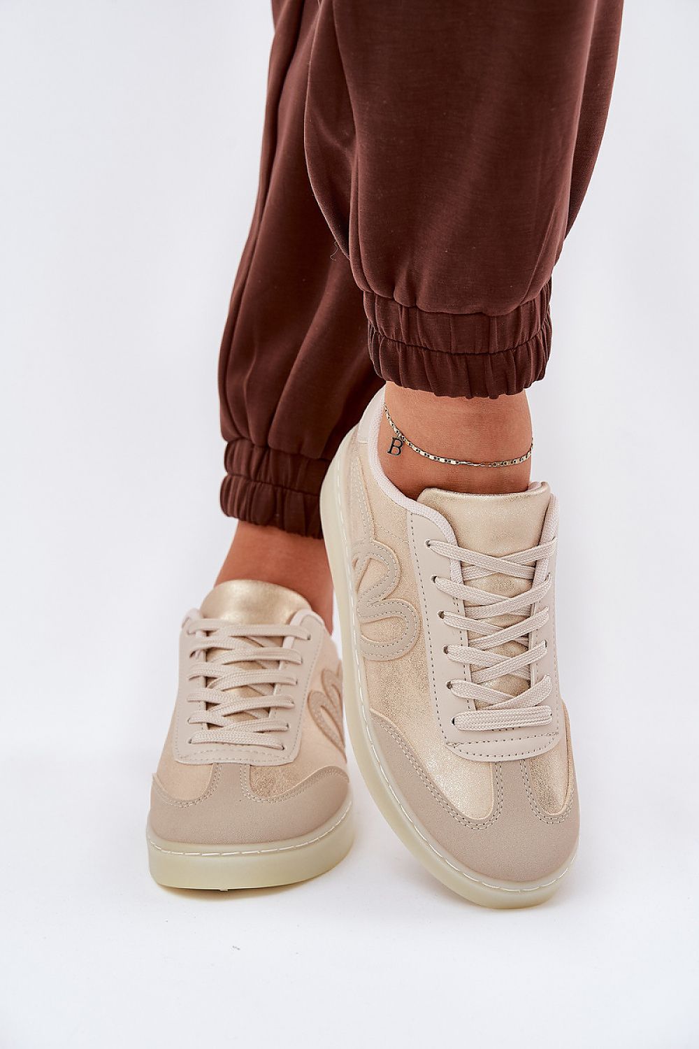 beige sport shoes detail view