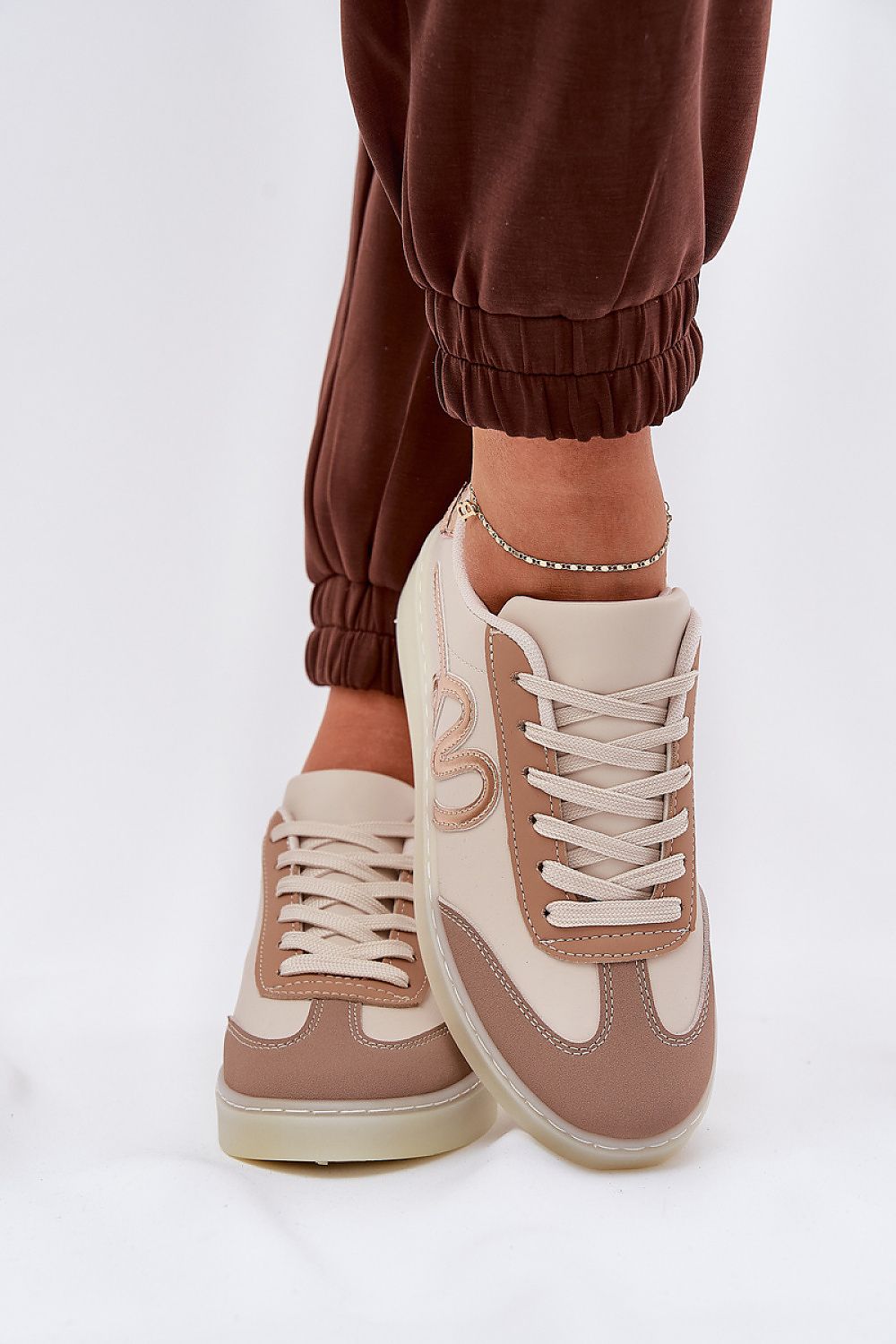 beige sport shoes back view