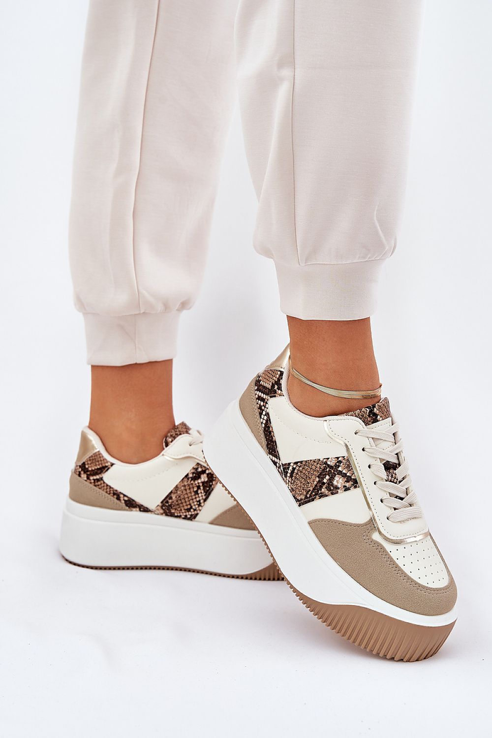 beige sport shoes front view