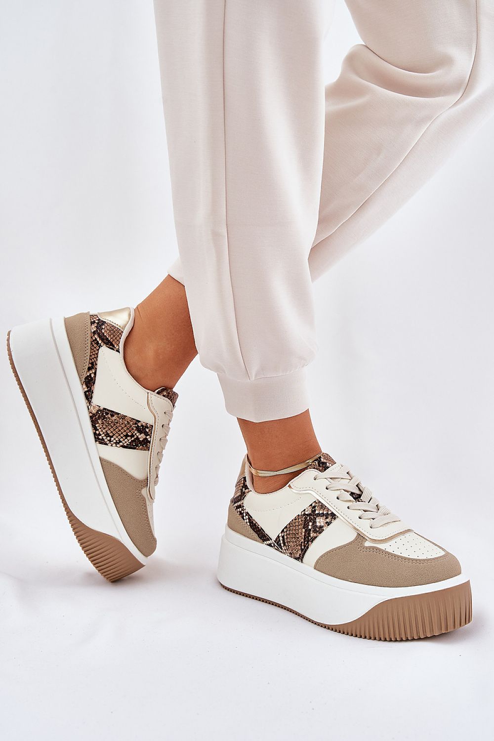 beige sport shoes detail view