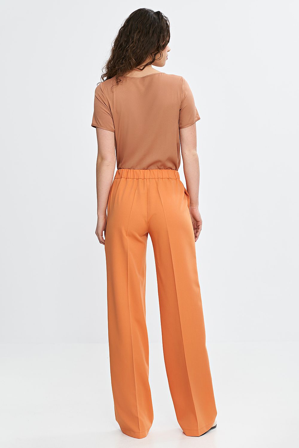 orange vivid orange women's wide leg trousers with comfortable fit and elegant details back view