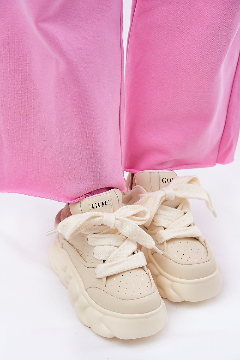 beige sport shoes detail view