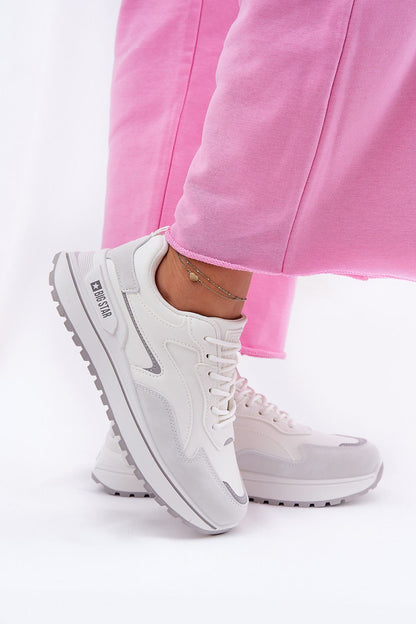 white sport shoes front view