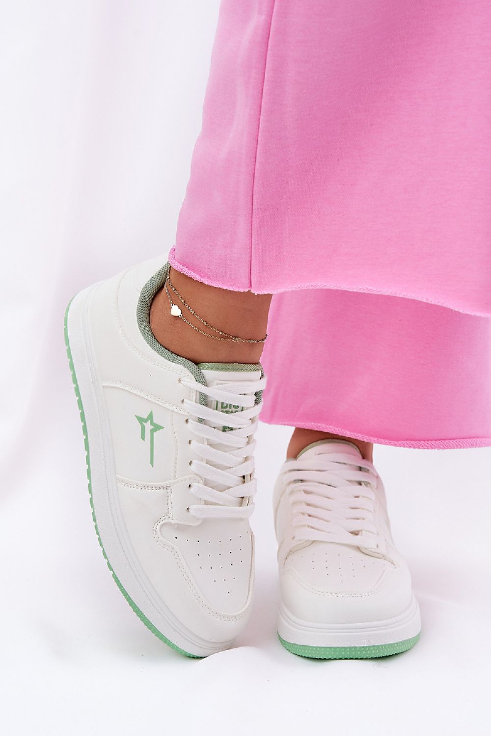 white sport shoes front view