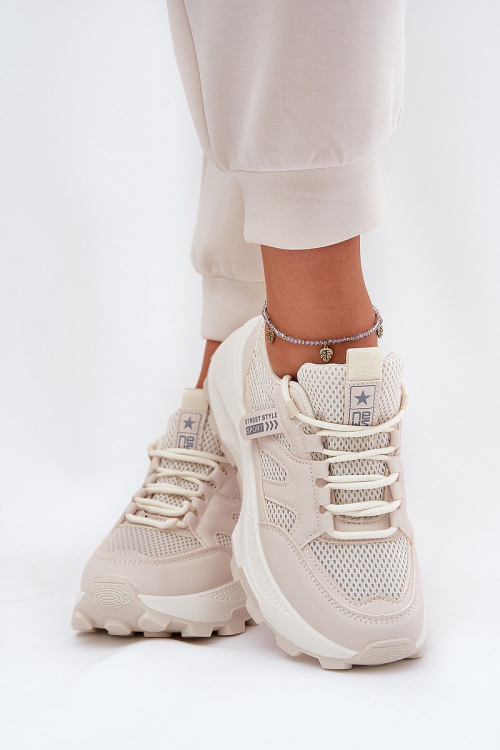 beige sport shoes detail view