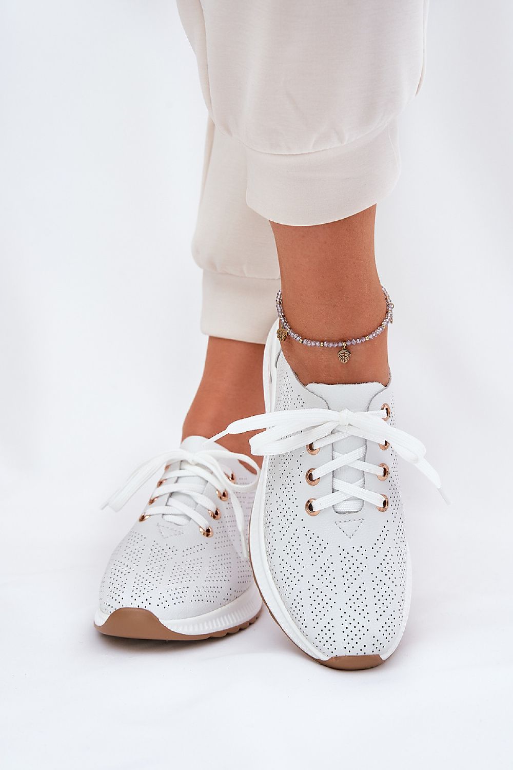 beige sport shoes back view