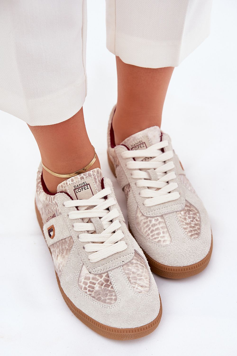 beige sport shoes detail view