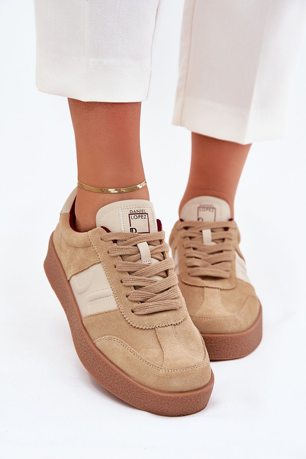 beige sport shoes detail view