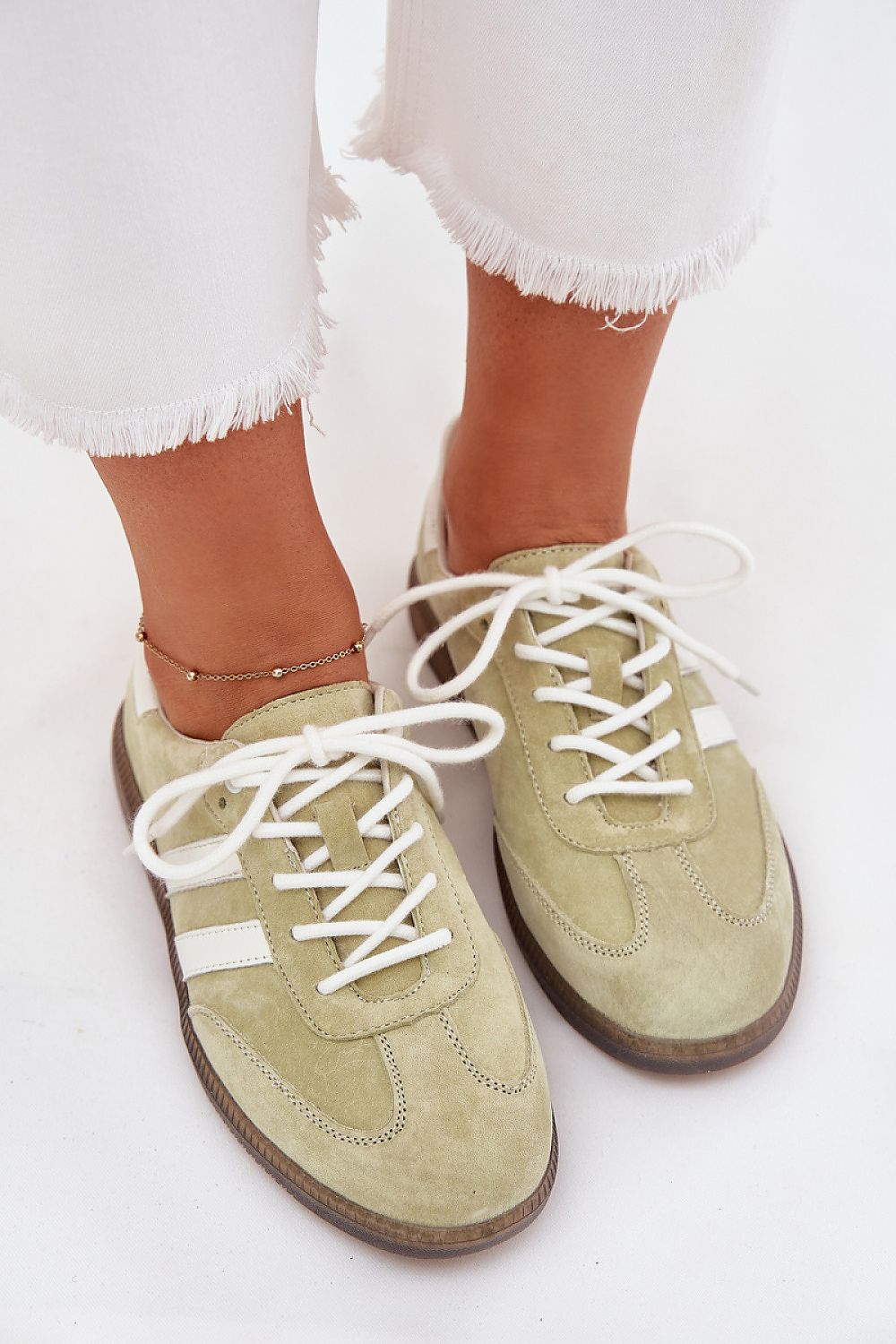 green sport shoes detail view