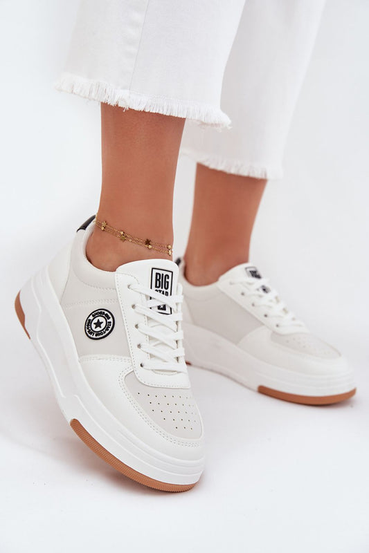 white sport shoes front view