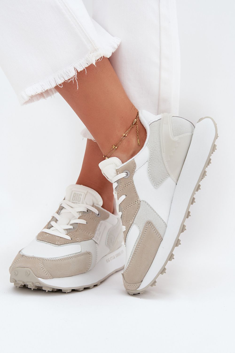 white sport shoes front view