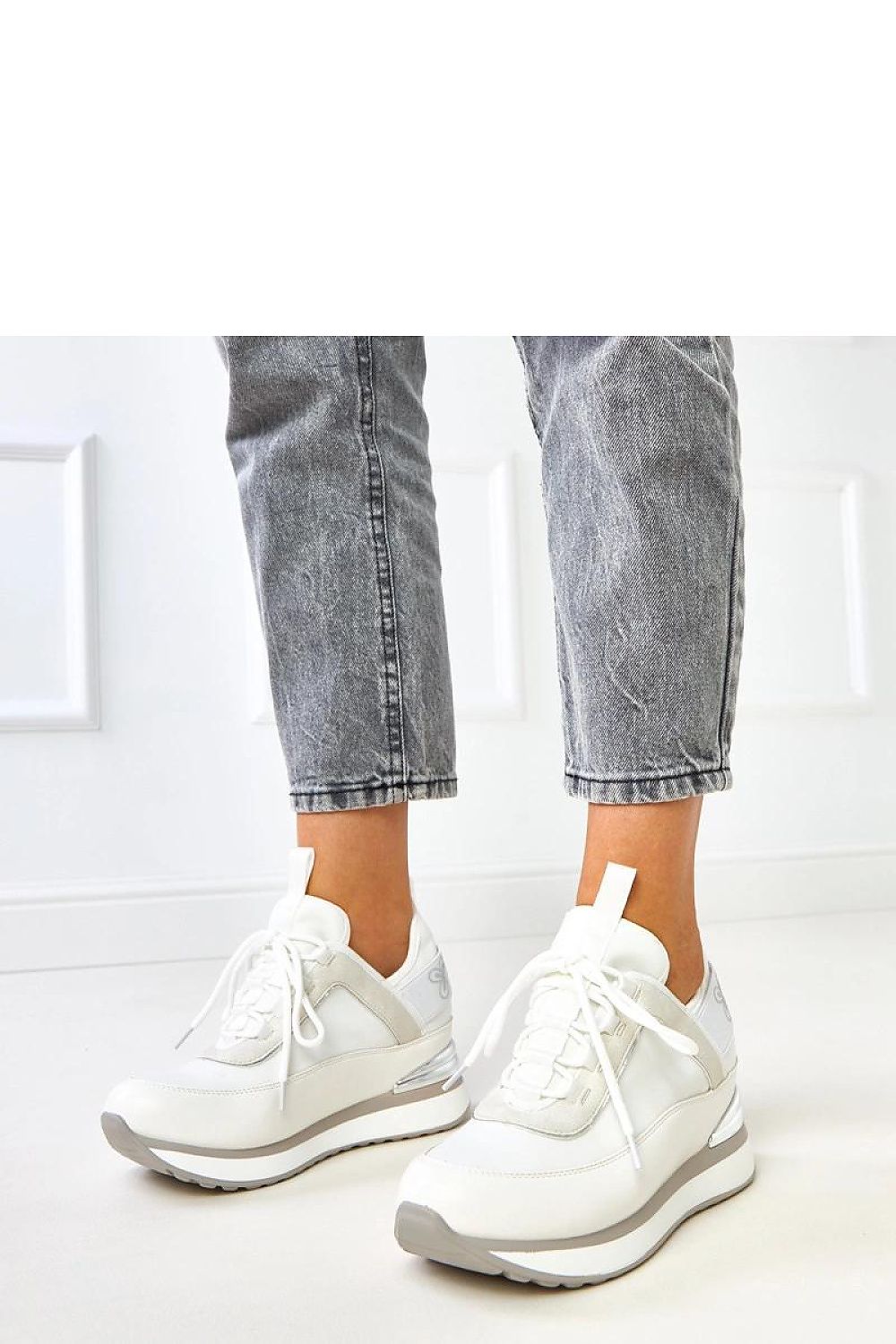 white sport shoes front view