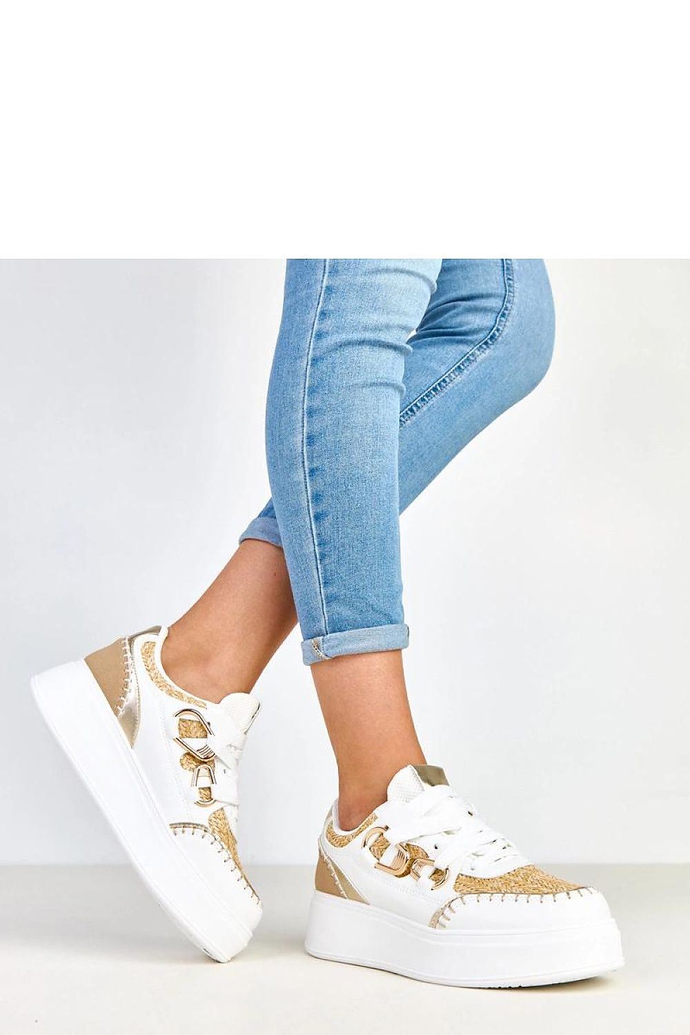 beige sport shoes detail view