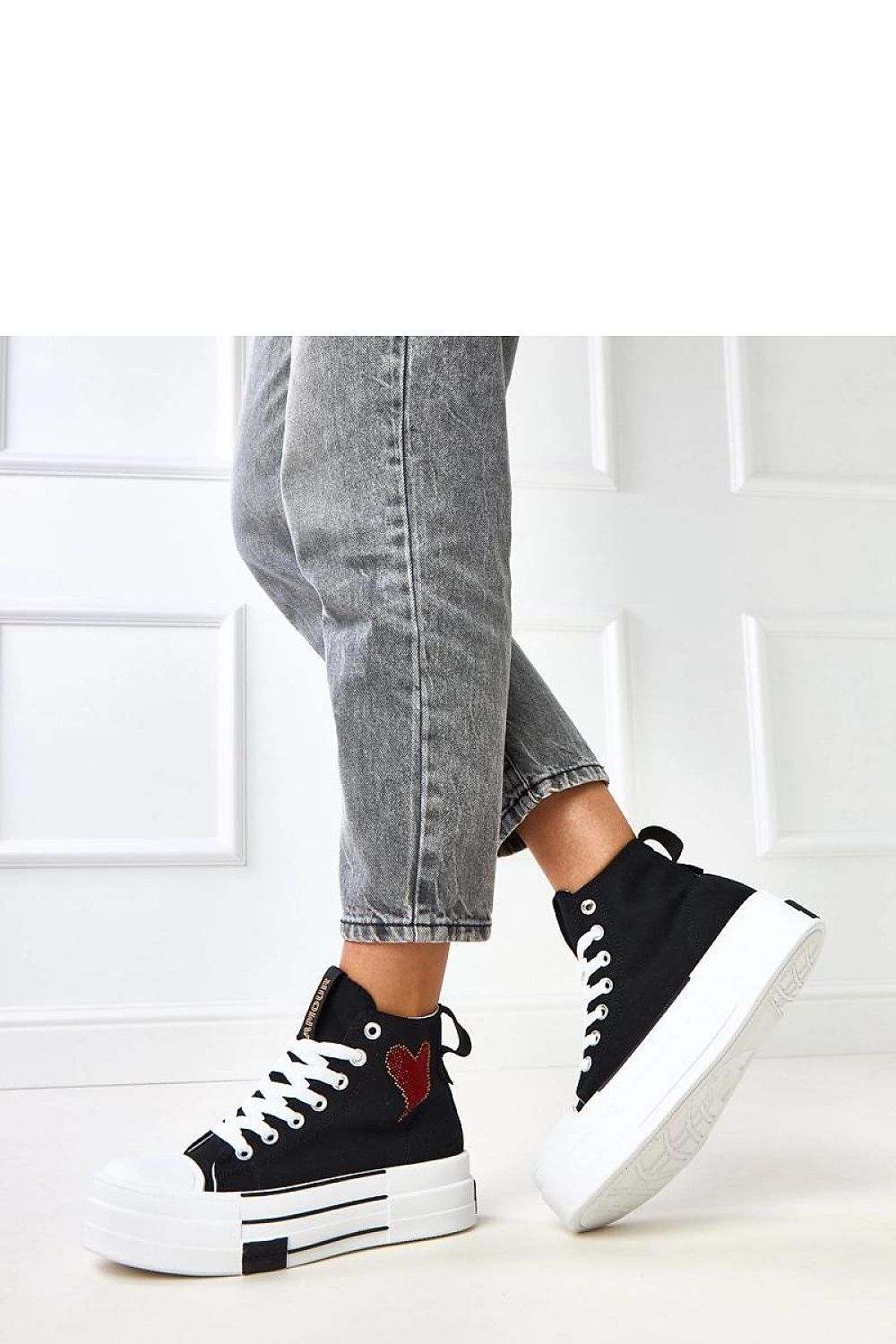 black lace sneakers detail view