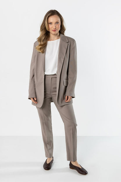 beige long sleeve jacket detail view