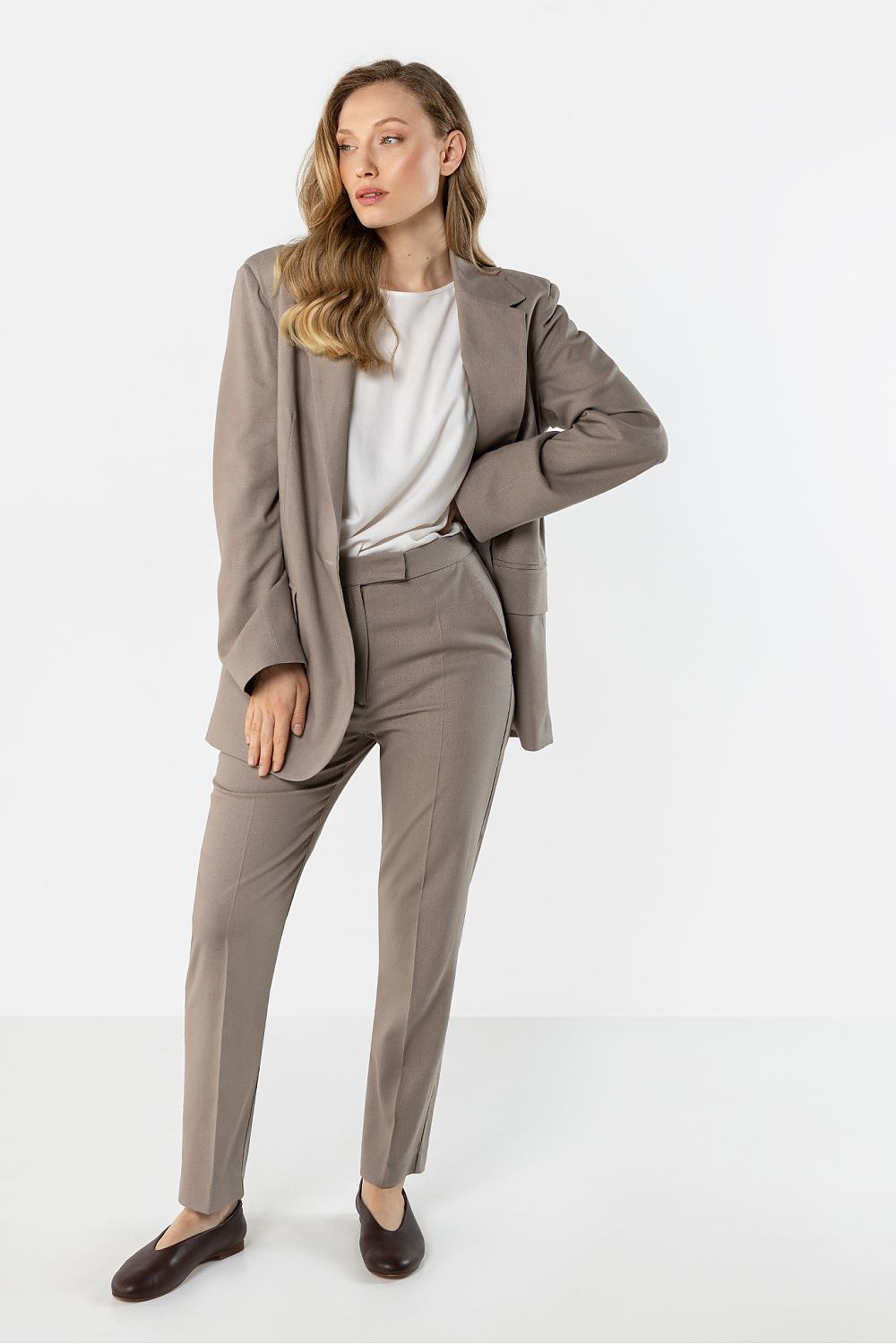 beige women trousers back view