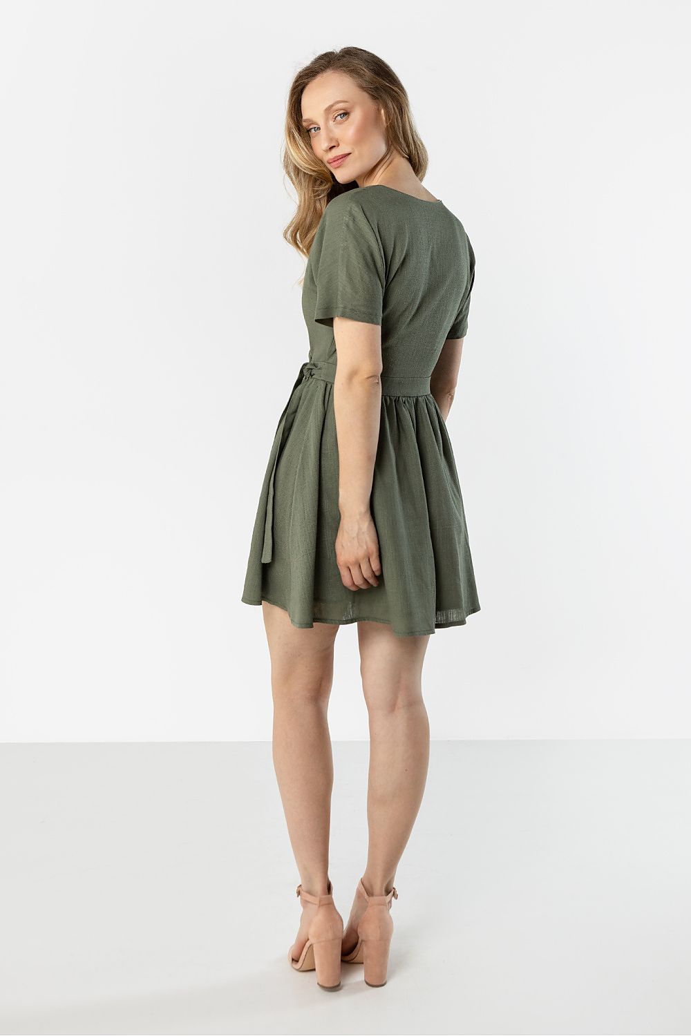 green wrap flared day dress detail view