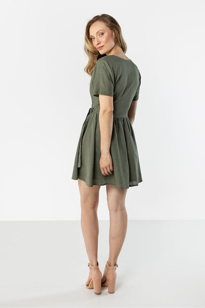 green wrap flared day dress detail view