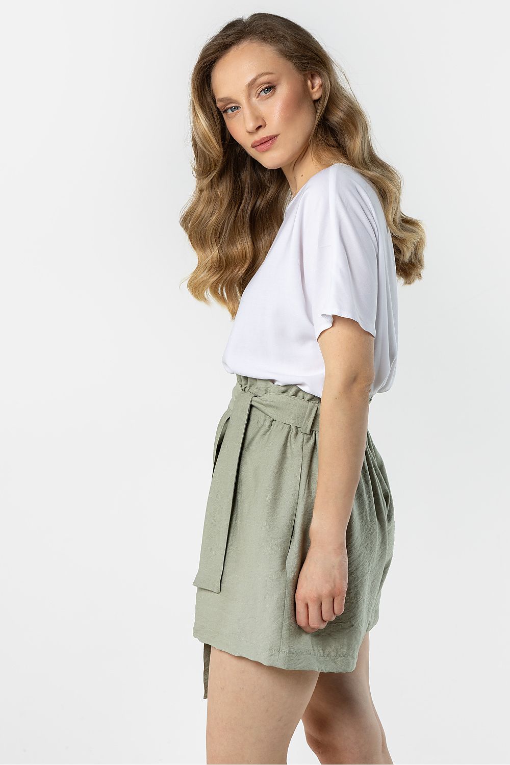 green pleated mini shorts detail view