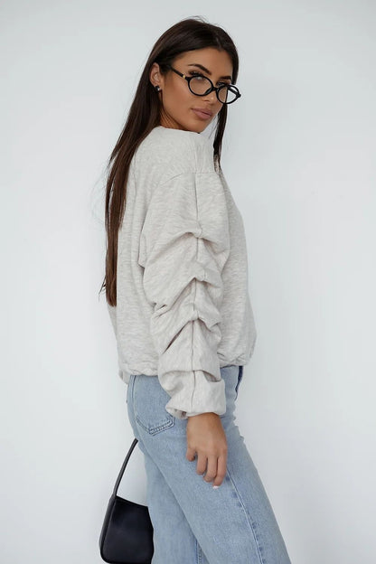 beige sweatshirt detail view