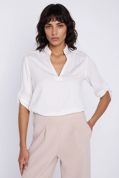 beige blouse front view
