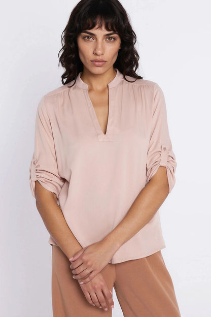 beige blouse side view