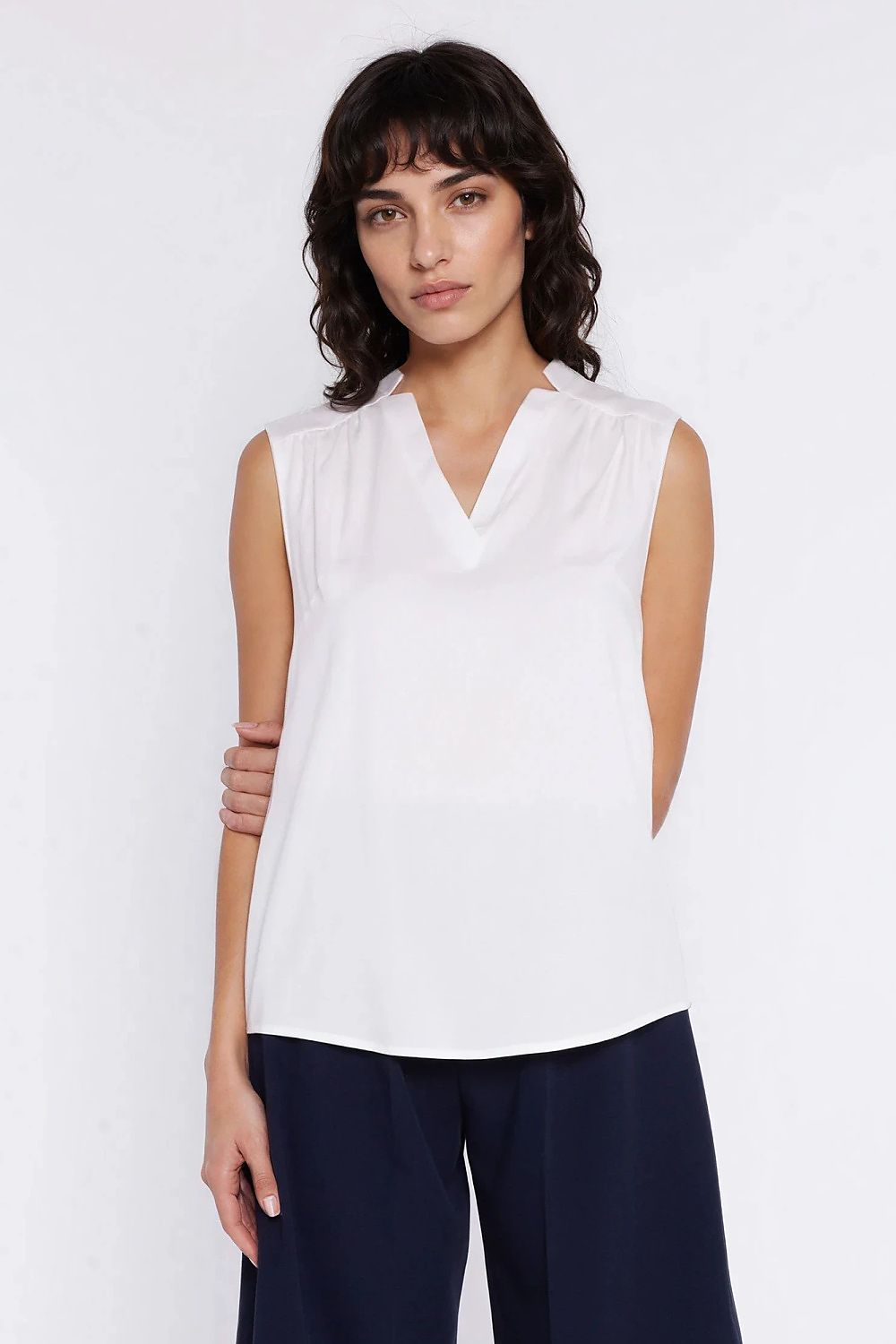 beige sleeveless v-neck blouse back view