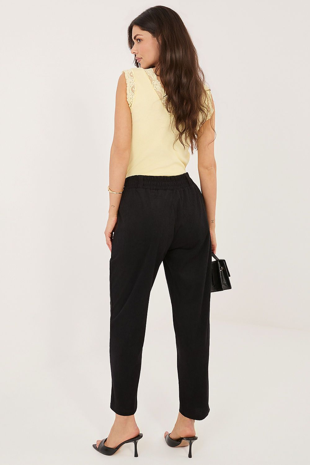 black corduroy trousers detail view