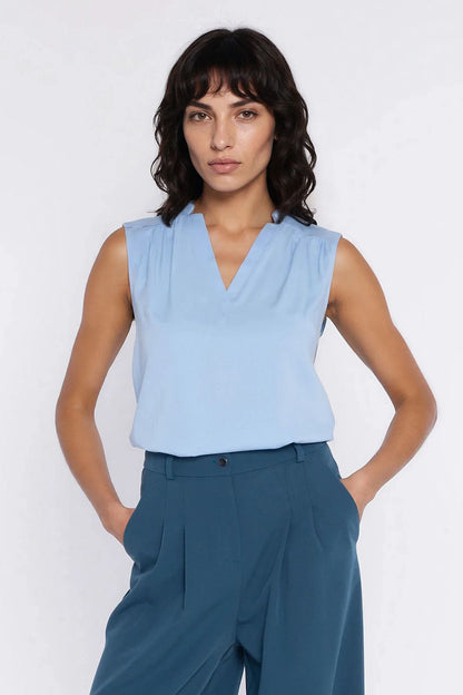 beige sleeveless v-neck blouse side view
