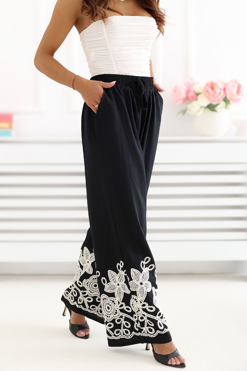 black mini women trousers back view