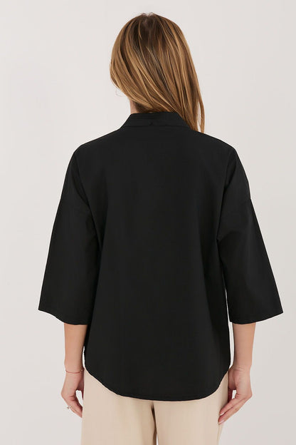 black v-neck mini shirt detail view