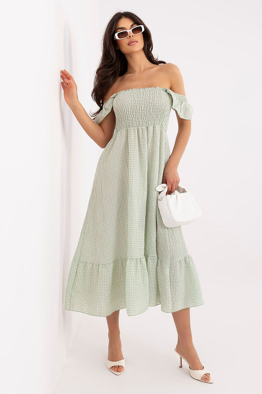 green flared ruffle day dress front view