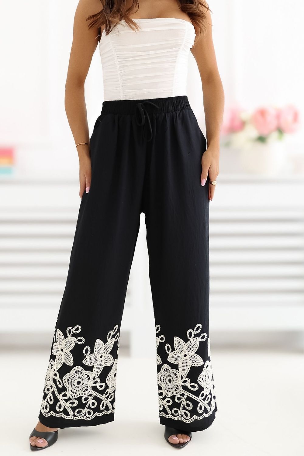 black mini women trousers side view