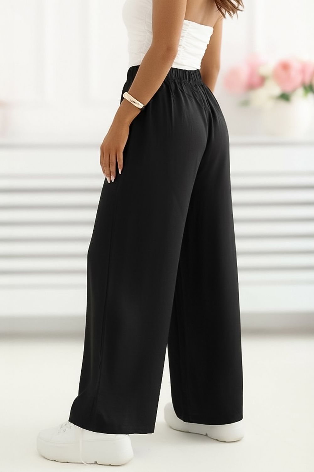black mini women trousers side view