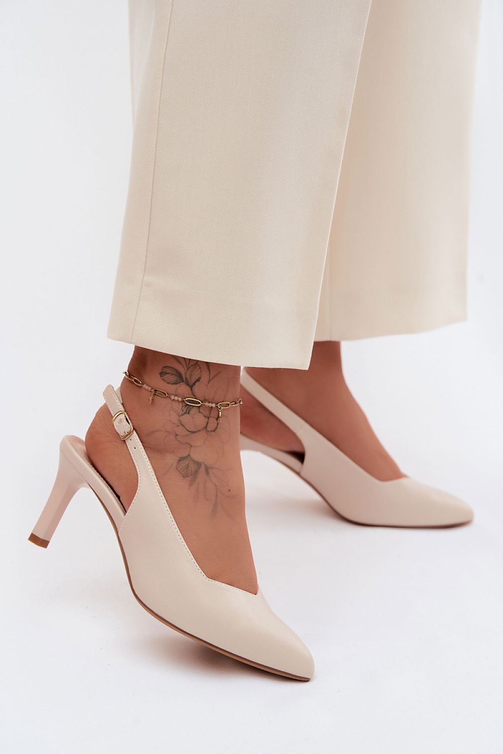 Women's Black and Beige Faux Leather Heeled Sandals back view