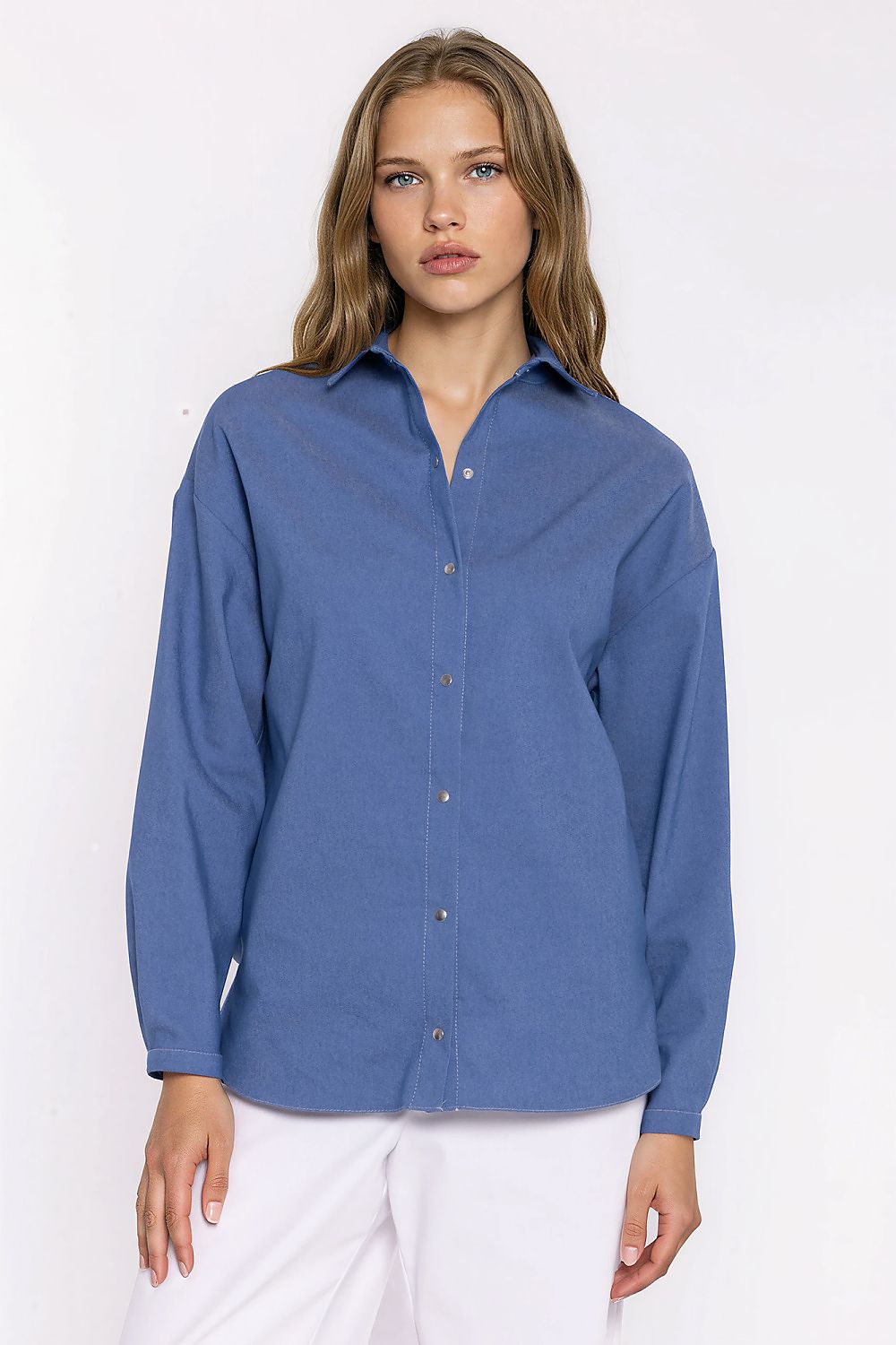 Women's blue oversized denim shirt with long sleeves and snap buttons by Nife