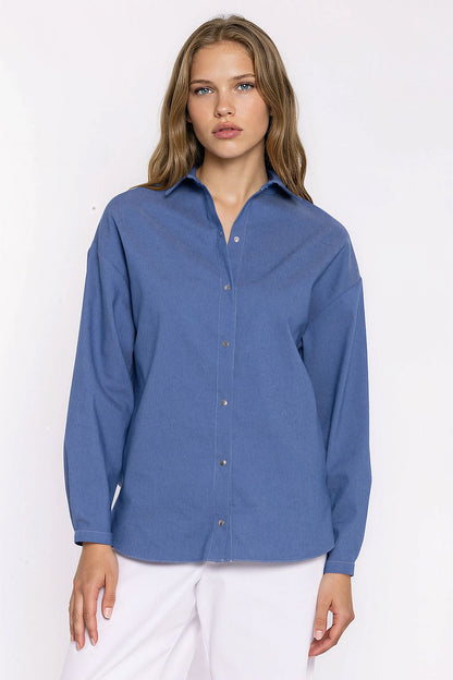 Women's blue oversized denim shirt with long sleeves and snap buttons by Nife