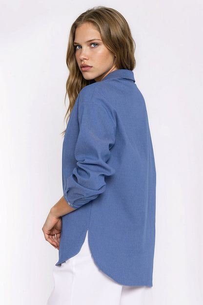 Women's blue oversized denim shirt with long sleeves and snap buttons by Nife