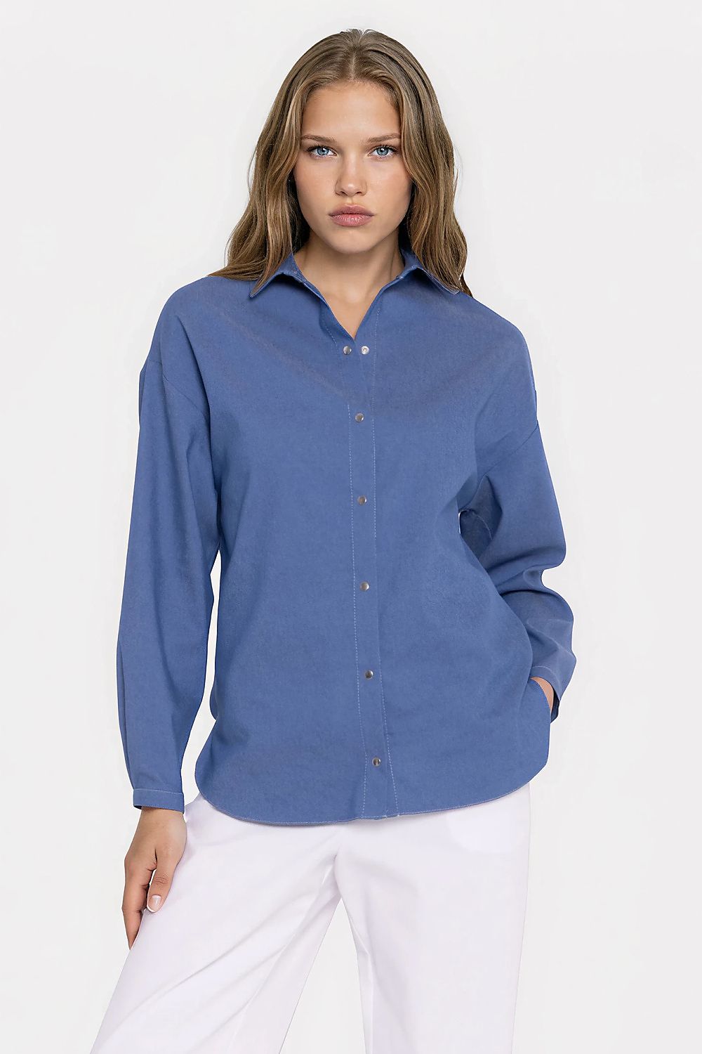 Women's blue oversized denim shirt with long sleeves and snap buttons by Nife