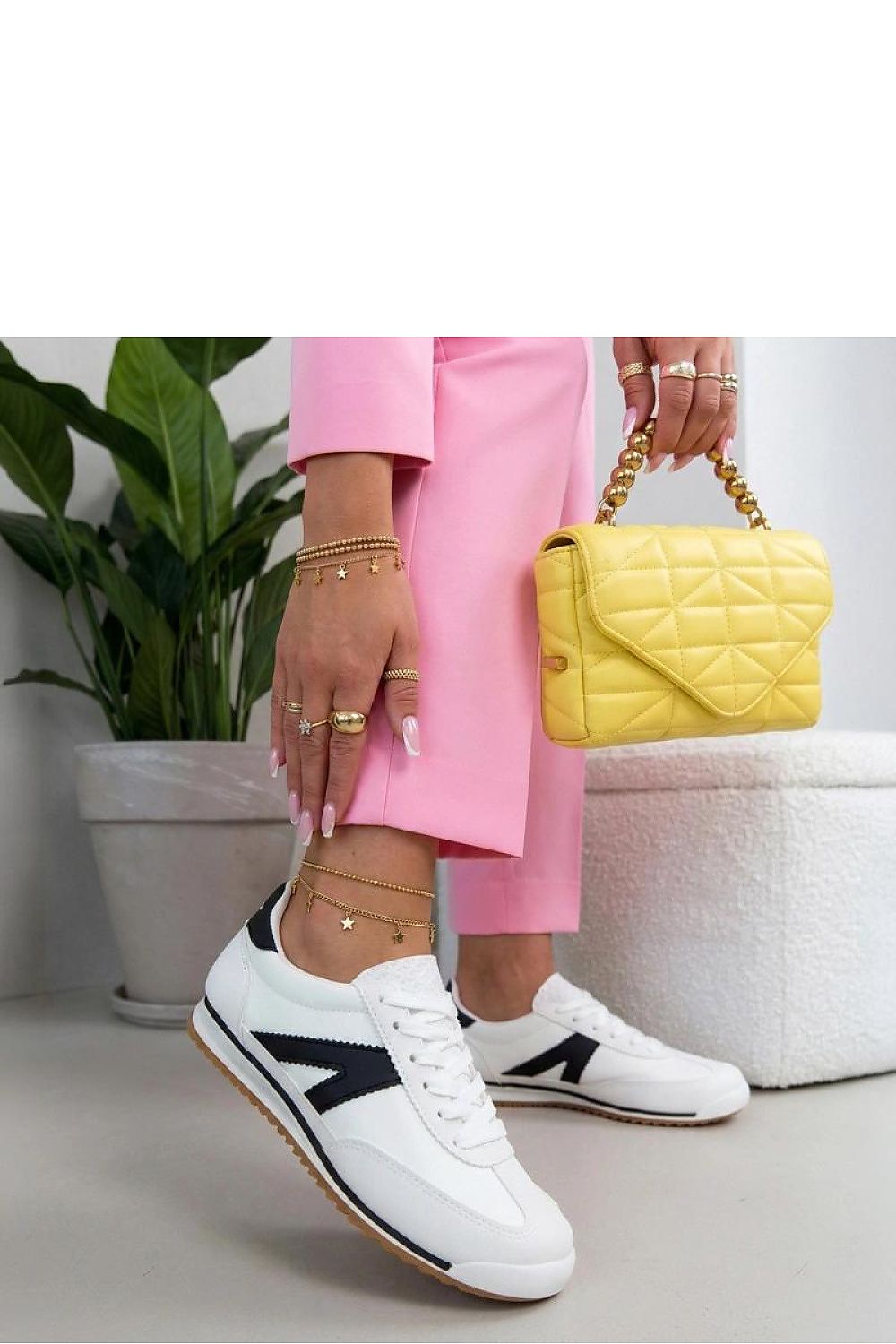 Women's White and Black Suede Sport Sneakers front view