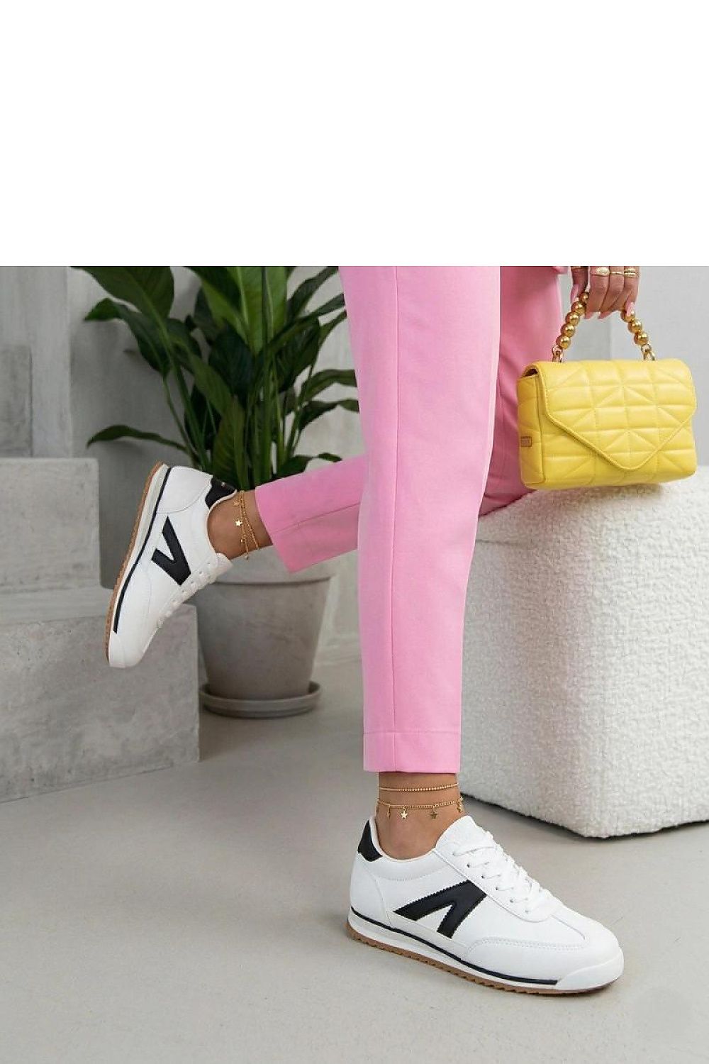 Women's White and Black Suede Sport Sneakers detail view