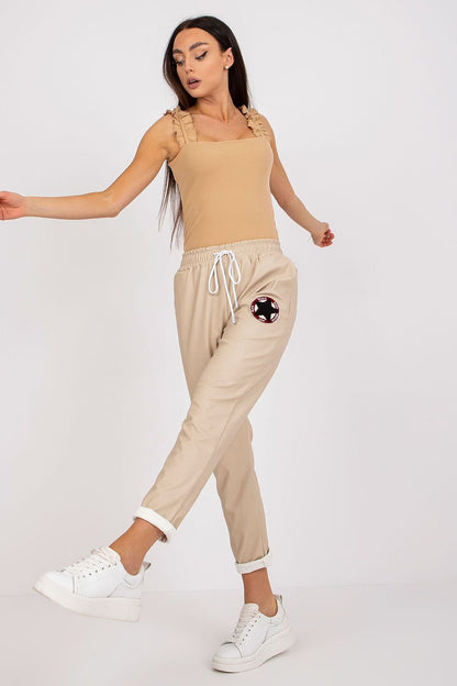 beige women trousers detail view